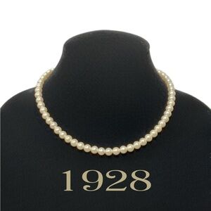 1928 Vintage Man Made Single Strand Off-White Pearls with Claw Clasp & Logo Fob